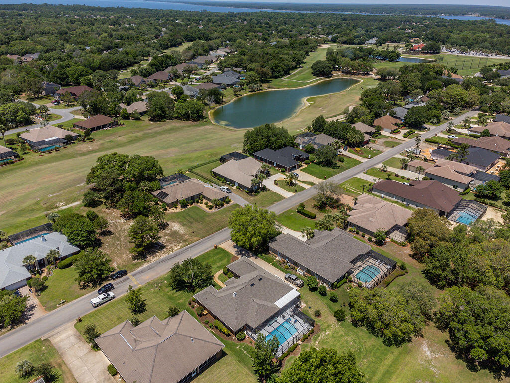 2655 Masters Boulevard Navarre, FL 32566 - Photo 71 of 87 an aerial view of residential houses with outdoor space