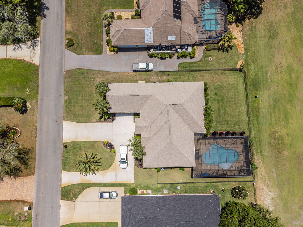 2655 Masters Boulevard Navarre, FL 32566 - Photo 75 of 87 an aerial view of a house with a swimming pool