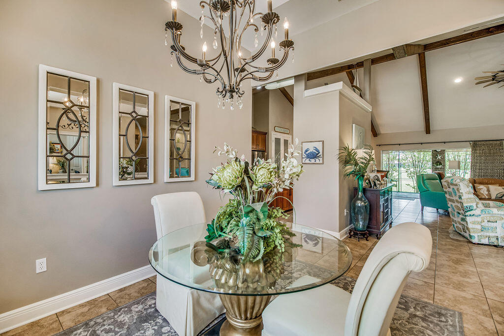 2655 Masters Boulevard Navarre, FL 32566 - Photo 8 of 87 a living room with furniture and a potted plant