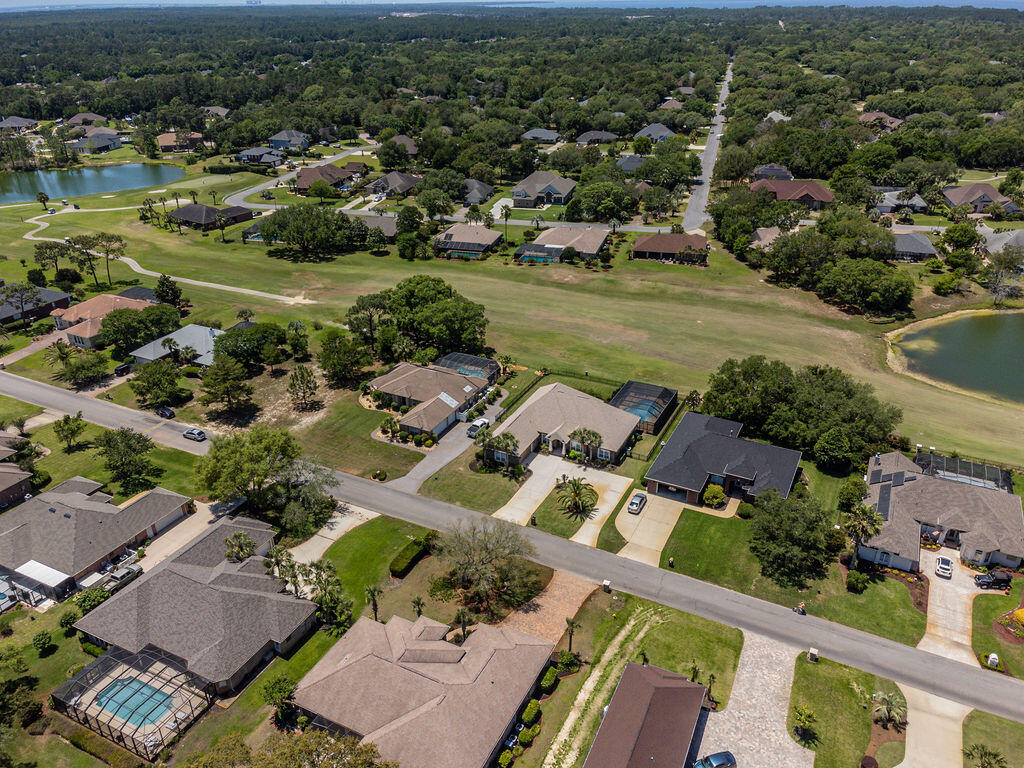 2655 Masters Boulevard Navarre, FL 32566 - Photo 83 of 87 an aerial view of residential houses with outdoor space