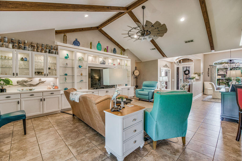 2655 Masters Boulevard Navarre, FL 32566 - Photo 10 of 87 a very nice looking living room with furniture and a large window