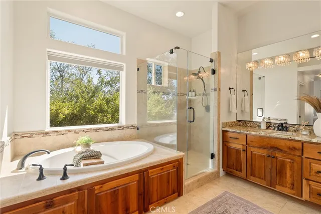 a bathroom with a granite countertop sink a toilet and a mirror