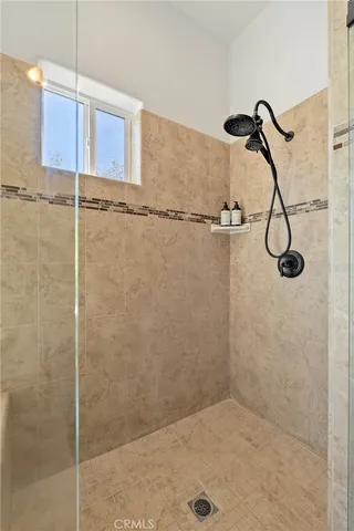 a view of a street with houses on both side