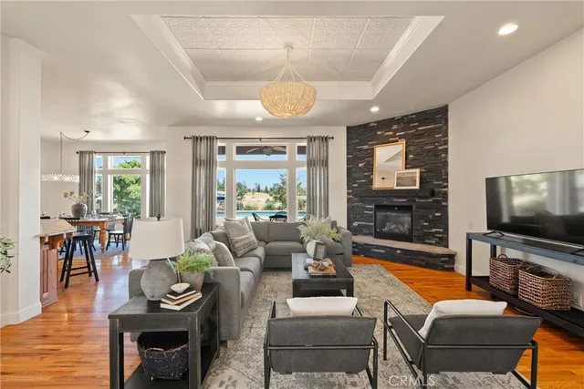 a living room with furniture ceiling fan and a rug