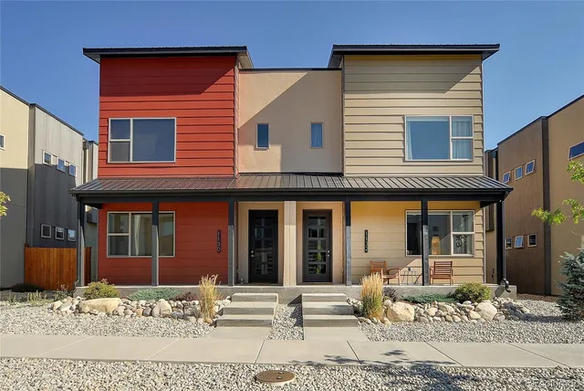 a front view of a house with a lounge chair