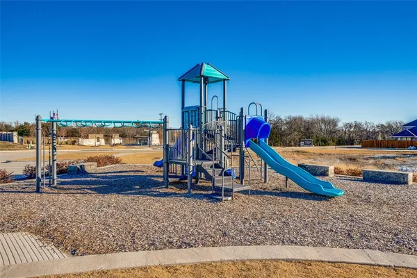 a view of a chairs and table in a room