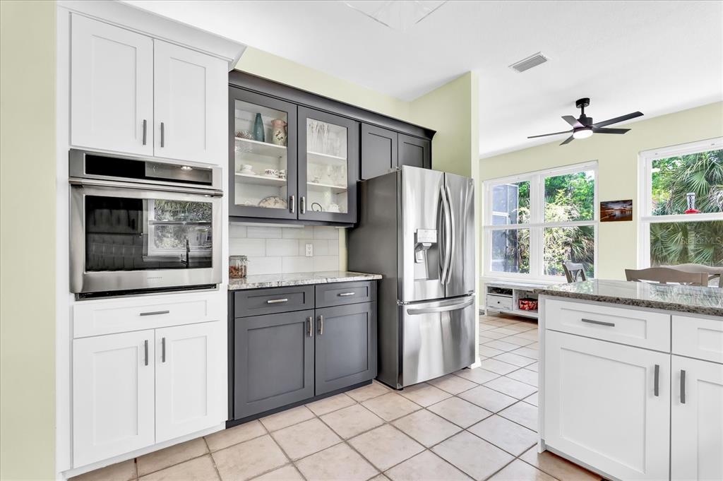 2 Bulow's Landing Flagler Beach, FL 32136 - Photo 12 of 42 a kitchen with stainless steel appliances a refrigerator sink and cabinets