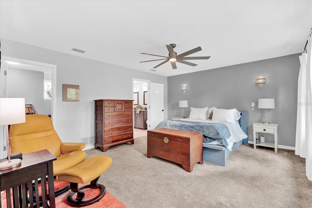 2 Bulow's Landing Flagler Beach, FL 32136 - Photo 17 of 42 a bed room with a bed window and a chair