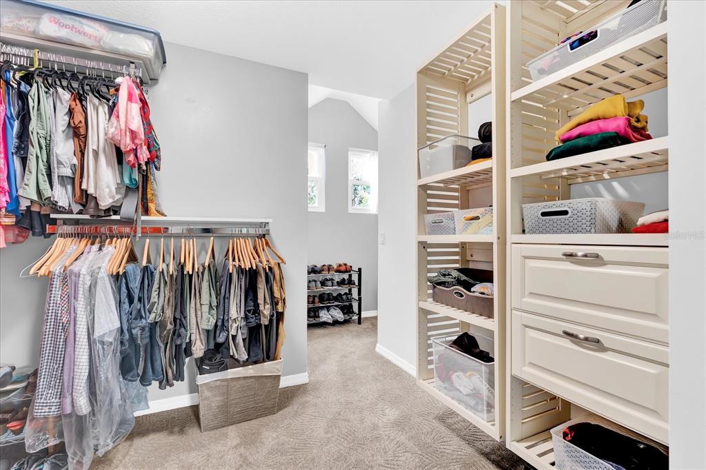 2 Bulow's Landing Flagler Beach, FL 32136 - Photo 21 of 42 a view of walk in closet with clothes and shoes