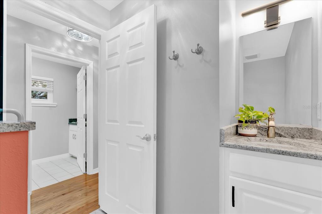 2 Bulow's Landing Flagler Beach, FL 32136 - Photo 29 of 42 a bathroom with a granite countertop sink a mirror and shower