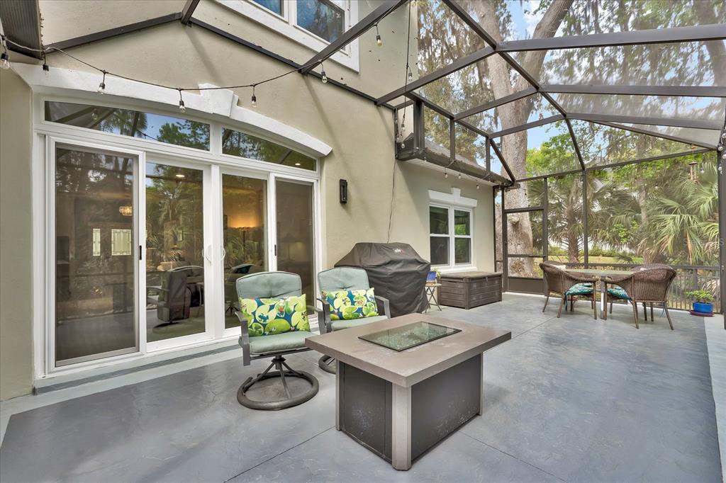 2 Bulow's Landing Flagler Beach, FL 32136 - Photo 32 of 42 a view of a patio with table and chairs and potted plants