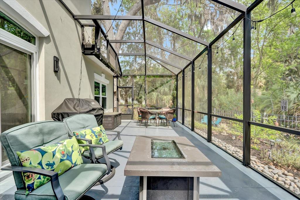 2 Bulow's Landing Flagler Beach, FL 32136 - Photo 35 of 42 a view of a dining room with furniture a chandelier and wooden floor