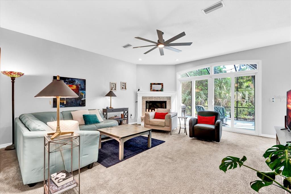 2 Bulow's Landing Flagler Beach, FL 32136 - Photo 4 of 42 a living room with furniture fireplace and a large window