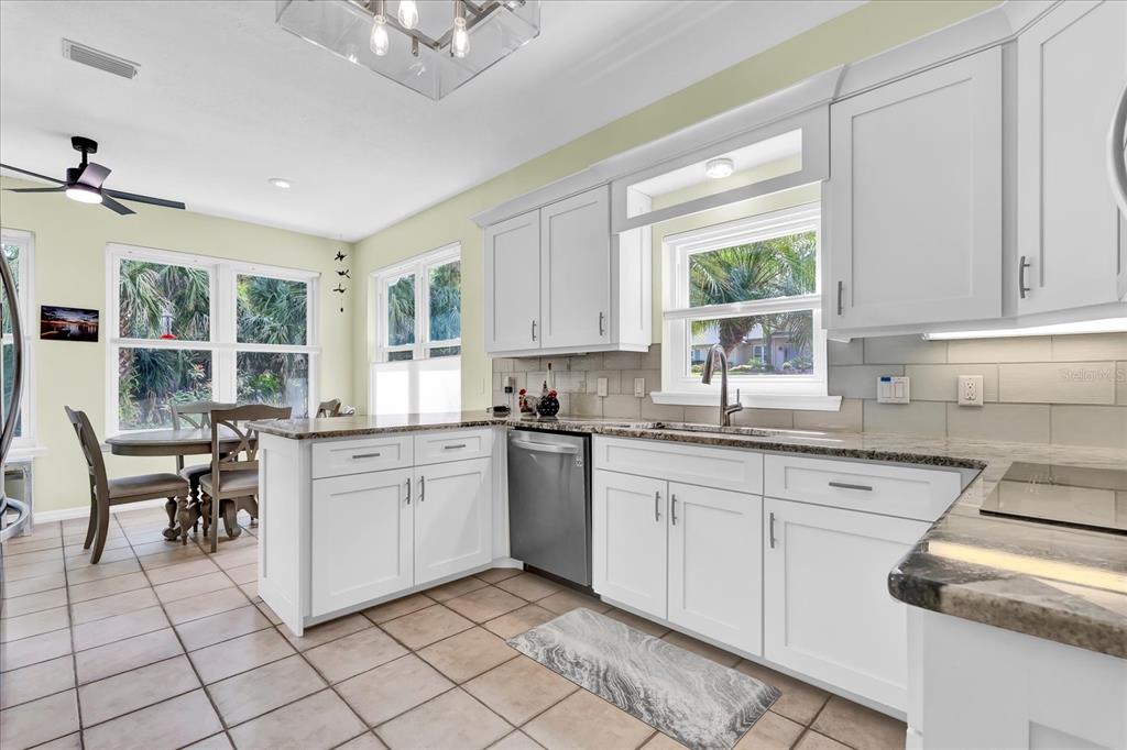 2 Bulow's Landing Flagler Beach, FL 32136 - Photo 10 of 42 a kitchen with cabinets and window