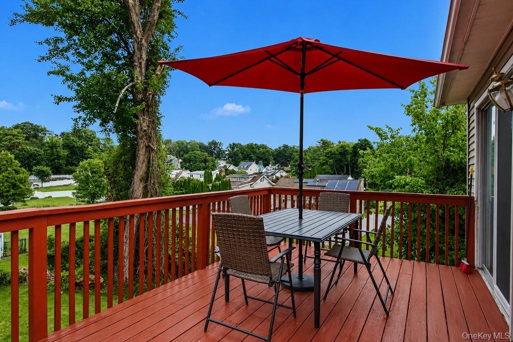 167 Kings Ferry Road Buchanan, NY 10511 - Photo 24 of 26 Spacious elevated deck with red-stained wood, directly off of dining room area