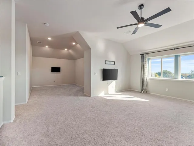 a view of livingroom with furniture and a ceiling fan