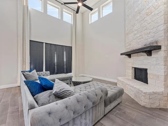 a bedroom with furniture and a fireplace