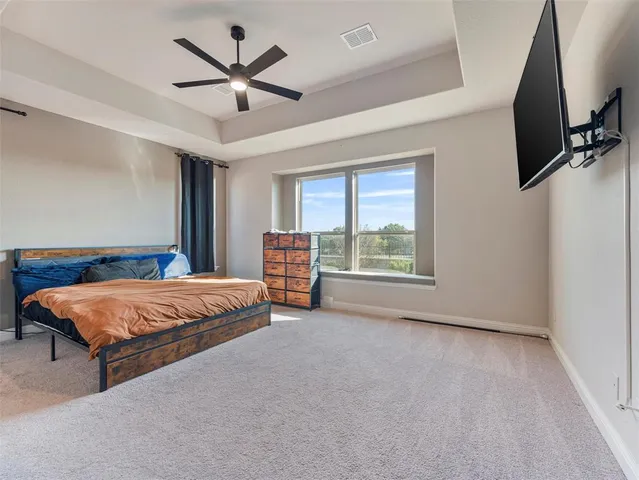 a large white kitchen with stainless steel appliances kitchen island granite countertop a large counter top stainless steel appliances and cabinets