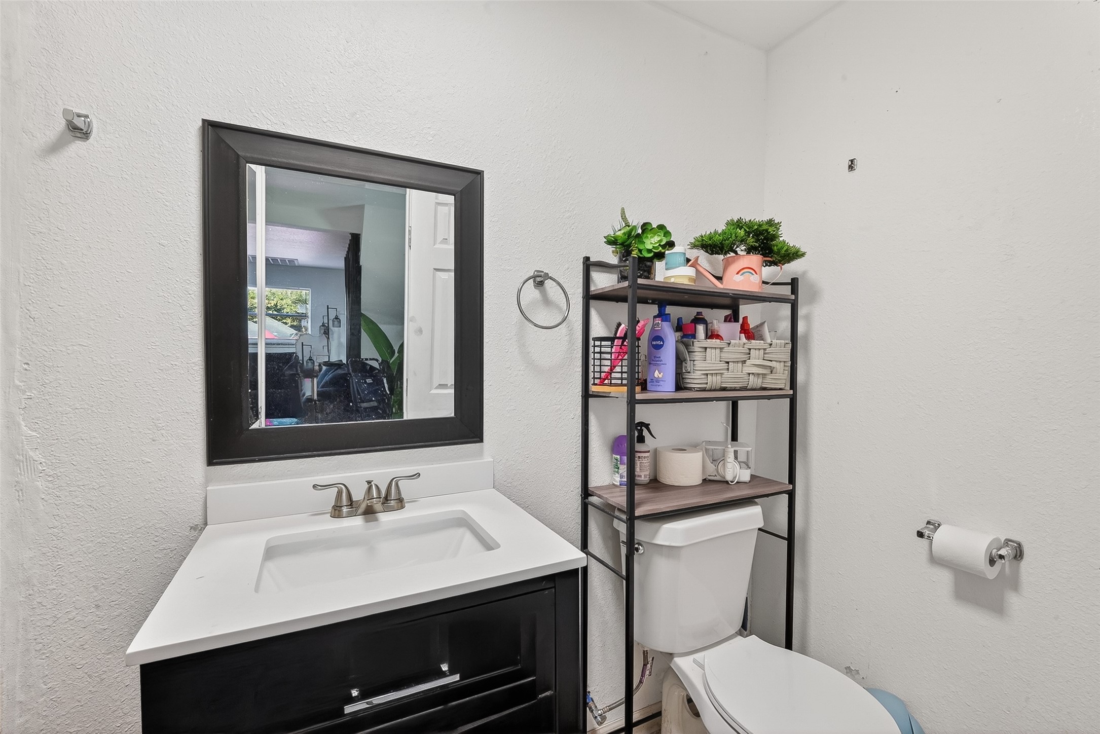 621 Elsbeth Road Channelview, TX 77530 - Photo 30 of 38 a bathroom with a sink vanity mirror and toilet