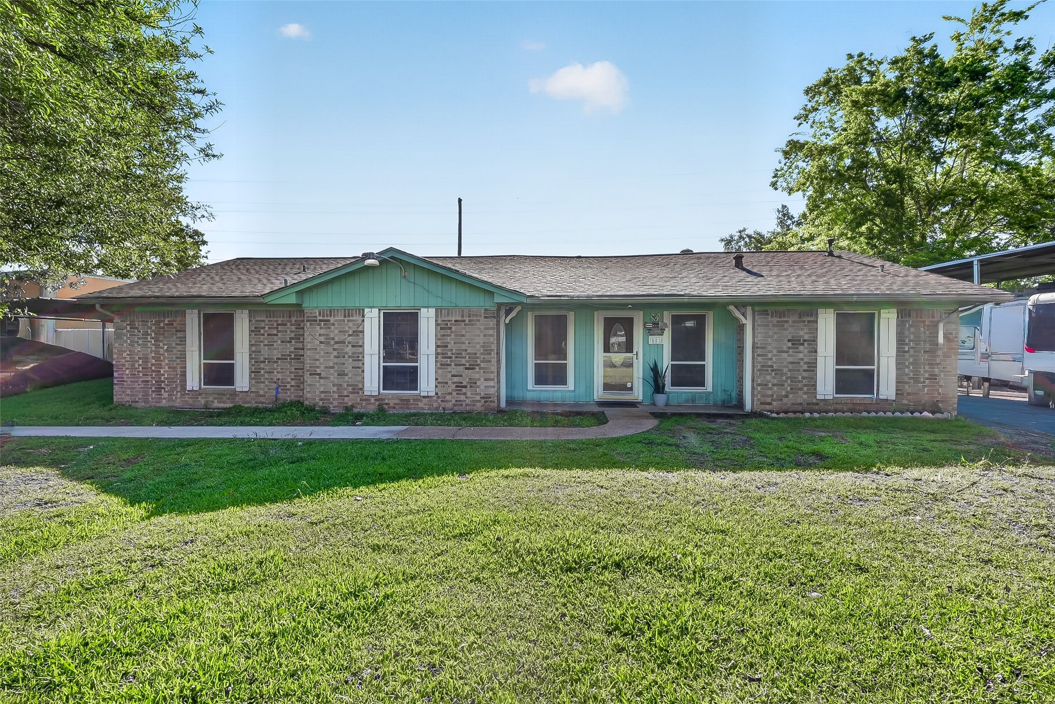 621 Elsbeth Road Channelview, TX 77530 - Photo 3 of 38 a front of a house with a garden