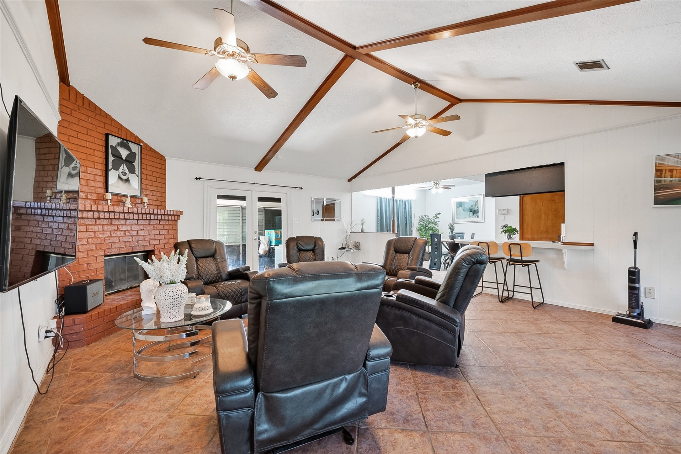 621 Elsbeth Road Channelview, TX 77530 - Photo 6 of 38 a living room with fireplace furniture and a ceiling fan