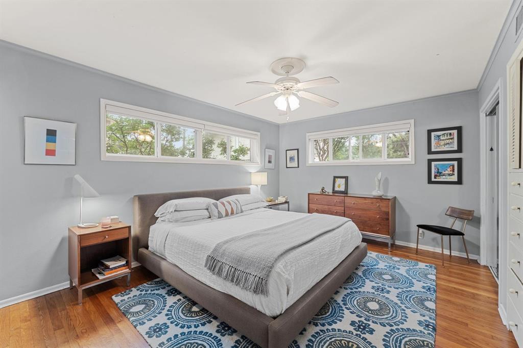 6135 Bandera Avenue, Unit A Dallas, TX 75225 - Photo 13 of 24 a bedroom with a bed a table and chair