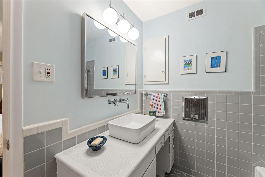6135 Bandera Avenue, Unit A Dallas, TX 75225 - Photo 15 of 24 a bathroom with a sink toilet and mirror