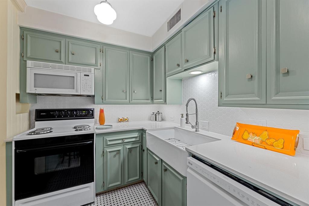 6135 Bandera Avenue, Unit A Dallas, TX 75225 - Photo 10 of 24 a kitchen with stainless steel appliances granite countertop a stove a sink and a microwave