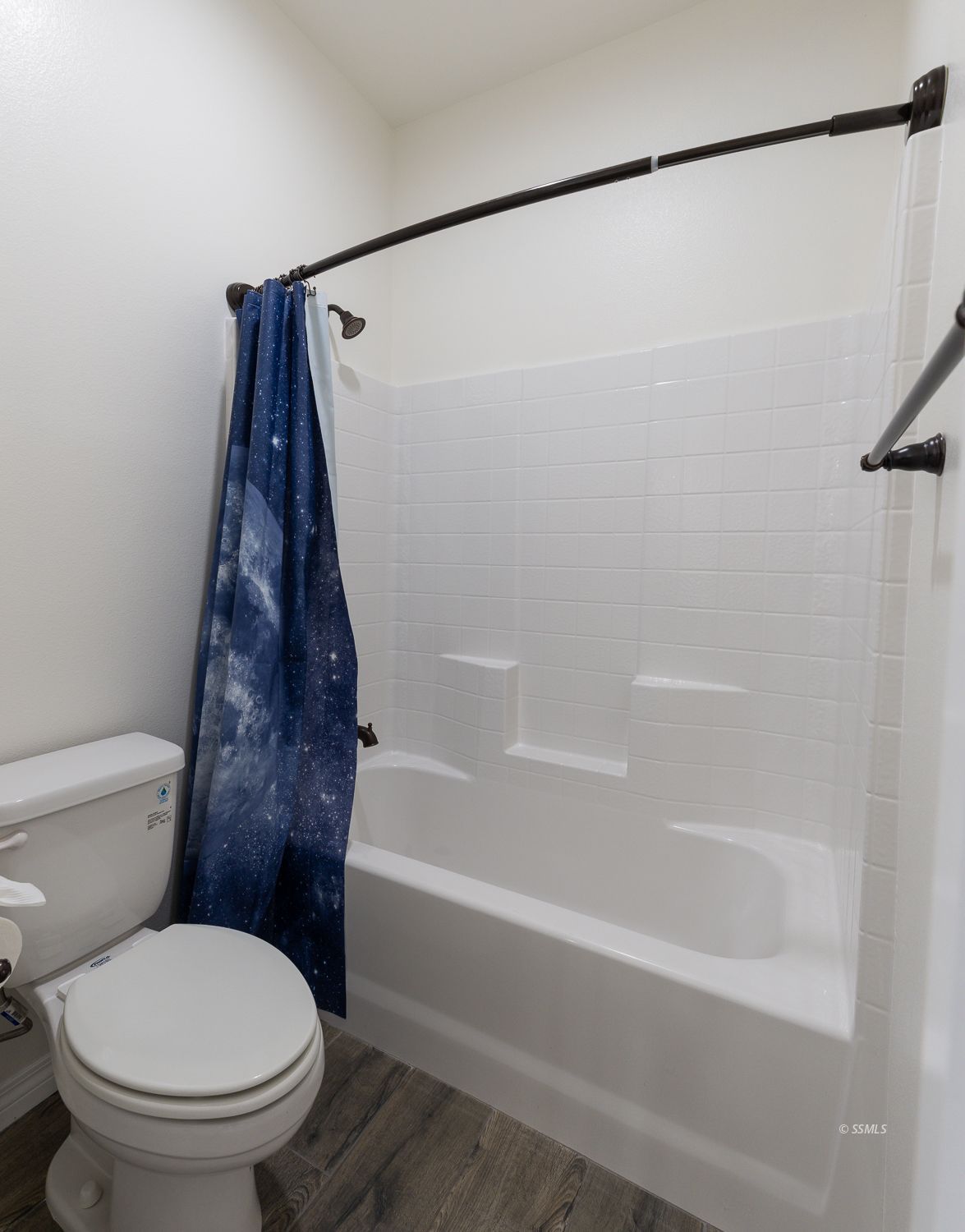 133 Rancho Del Cerro Ridgecrest, CA 93555 - Photo 29 of 50 a white toilet sitting next to a bath tub