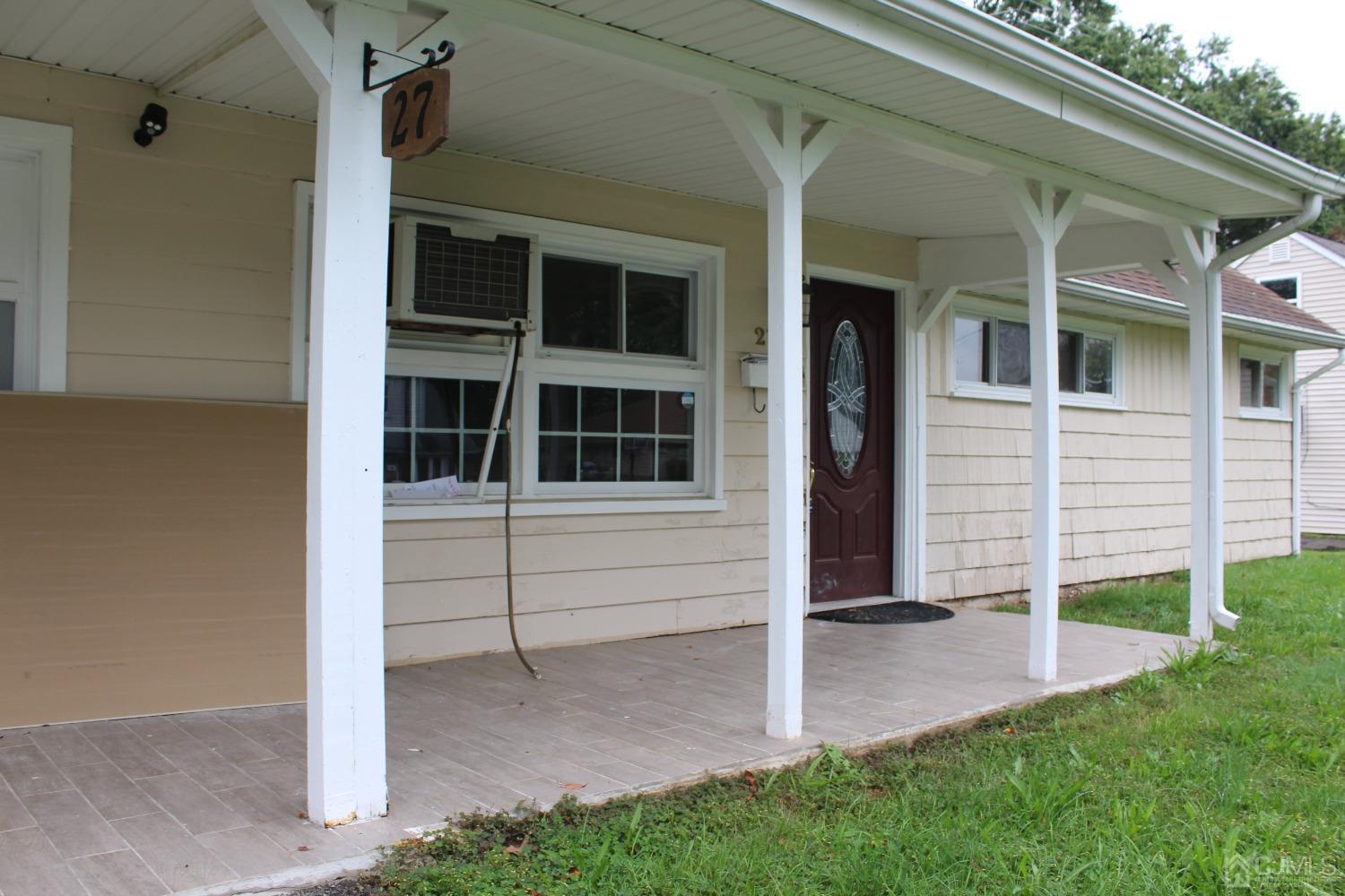 27 Markham Road Edison, NJ 08817 - Photo 1 of 28 a view of a house with backyard