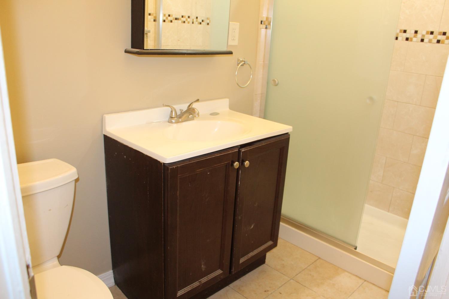 27 Markham Road Edison, NJ 08817 - Photo 12 of 28 a bathroom with a sink and a toilet