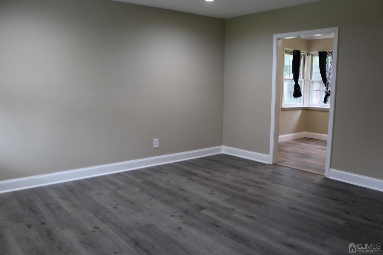 27 Markham Road Edison, NJ 08817 - Photo 17 of 28 wooden floor in an empty room