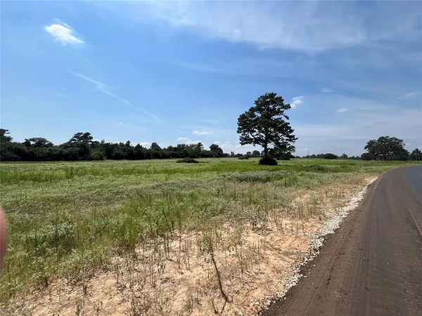 a view of a lake with houses in the background
