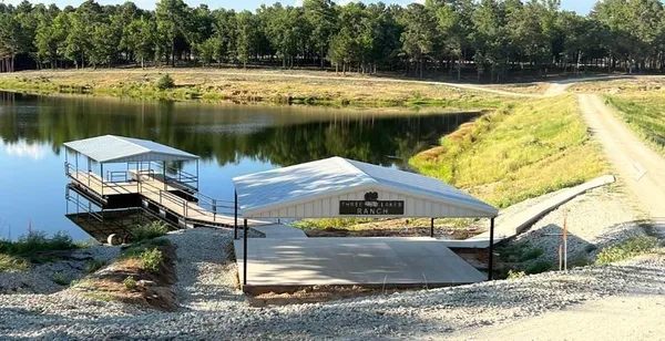a view of a wooden deck with a yard