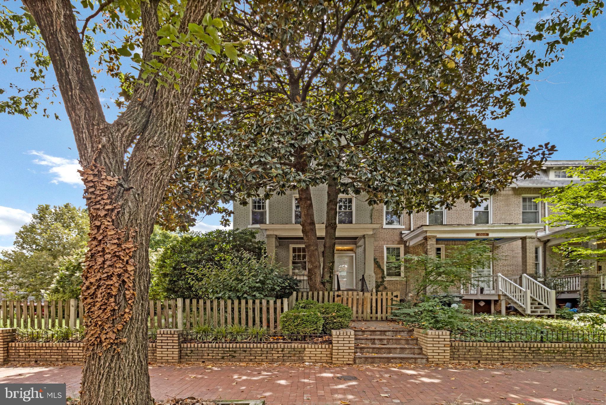 a view of a house with a tree