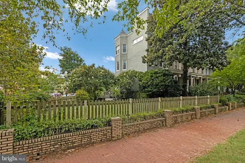 a view of a fence in a backyard