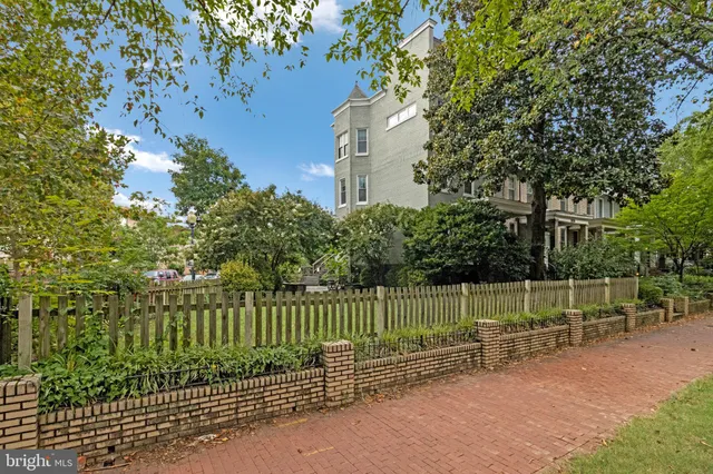 a view of a fence in a backyard