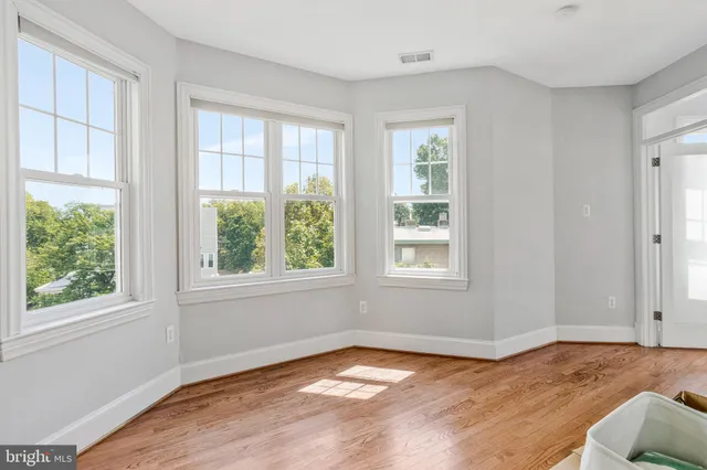 a view of a livingroom with furniture and wooden floor