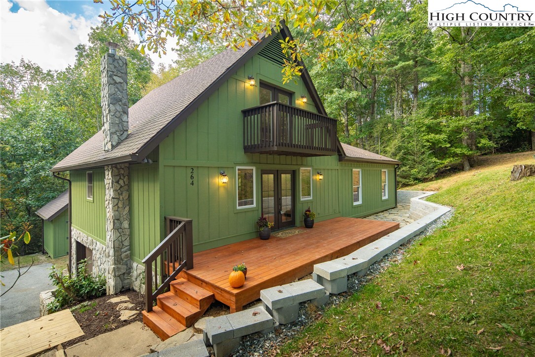 264 Foggy Lane Boone, NC 28607 - Photo 2 of 32 an aerial view of a house with swimming pool