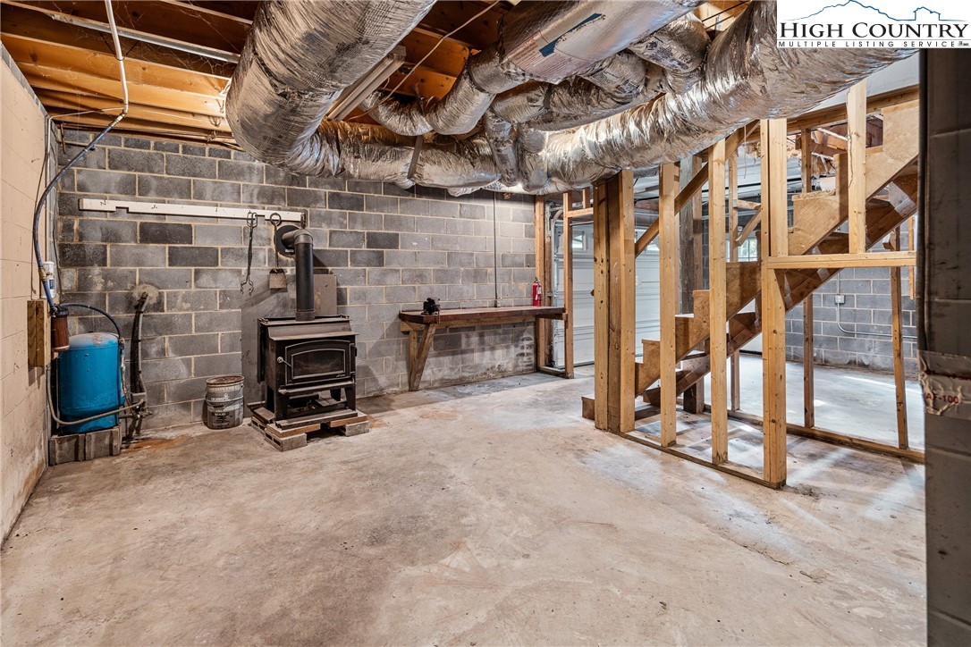 264 Foggy Lane Boone, NC 28607 - Photo 28 of 32 a view of an empty room with wooden floor and furniture