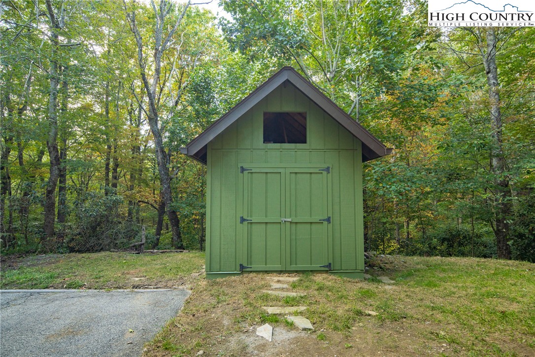 264 Foggy Lane Boone, NC 28607 - Photo 31 of 32 a view of a backyard with barn