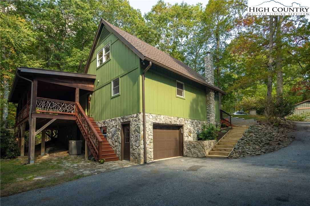 264 Foggy Lane Boone, NC 28607 - Photo 32 of 32 a front view of a house with garage