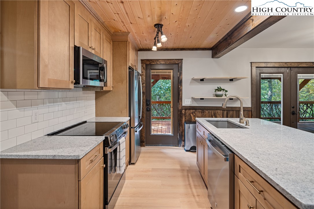 264 Foggy Lane Boone, NC 28607 - Photo 4 of 32 a kitchen that has a lot of cabinets in it