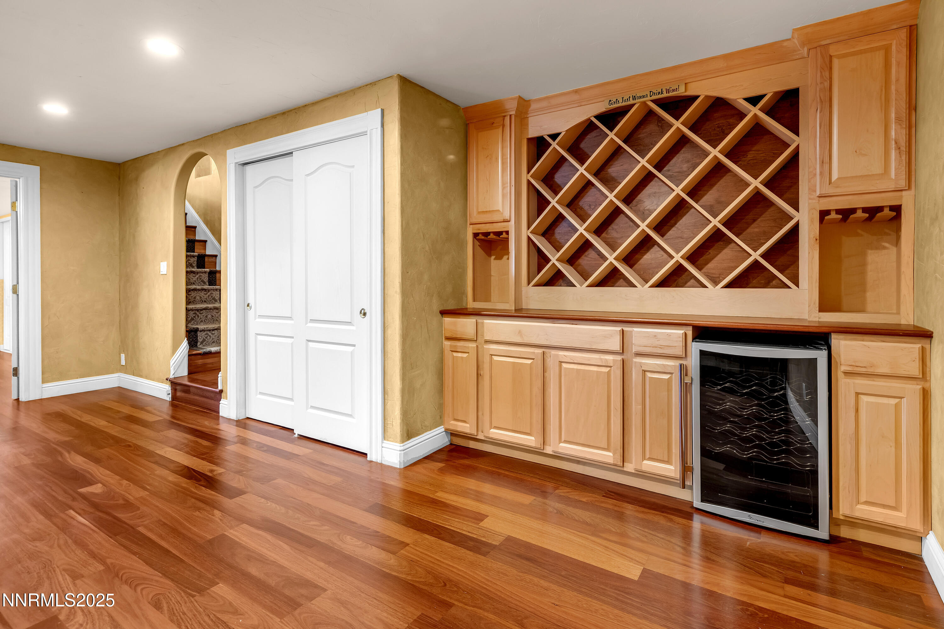 2835 Parkway Drive Reno, NV 89502 - Photo 17 of 39 an empty room with wooden floor and cabinet