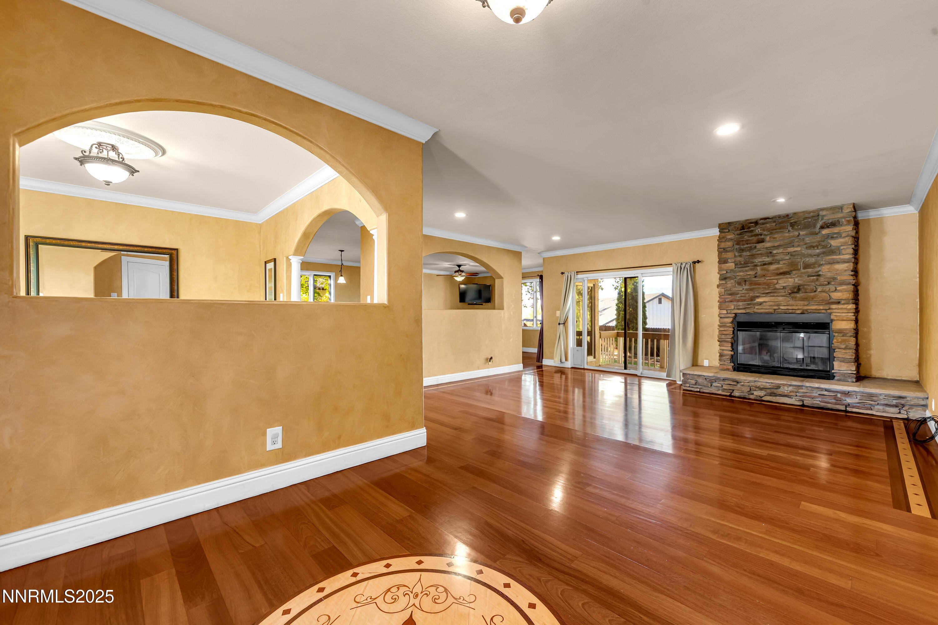 2835 Parkway Drive Reno, NV 89502 - Photo 2 of 39 a living room with fireplace furniture and a wooden floor