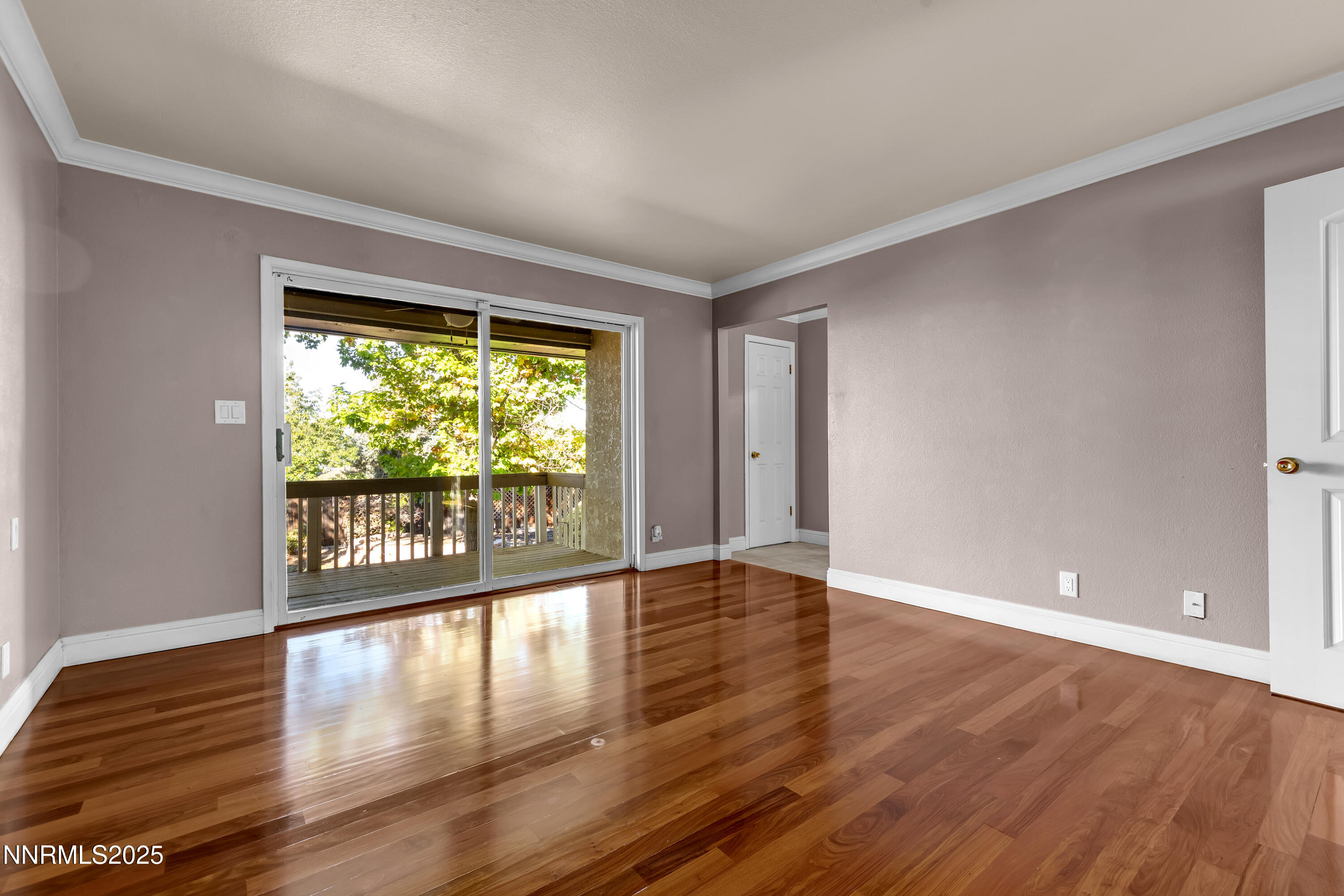 2835 Parkway Drive Reno, NV 89502 - Photo 22 of 39 a view of an empty room with wooden floor and a window