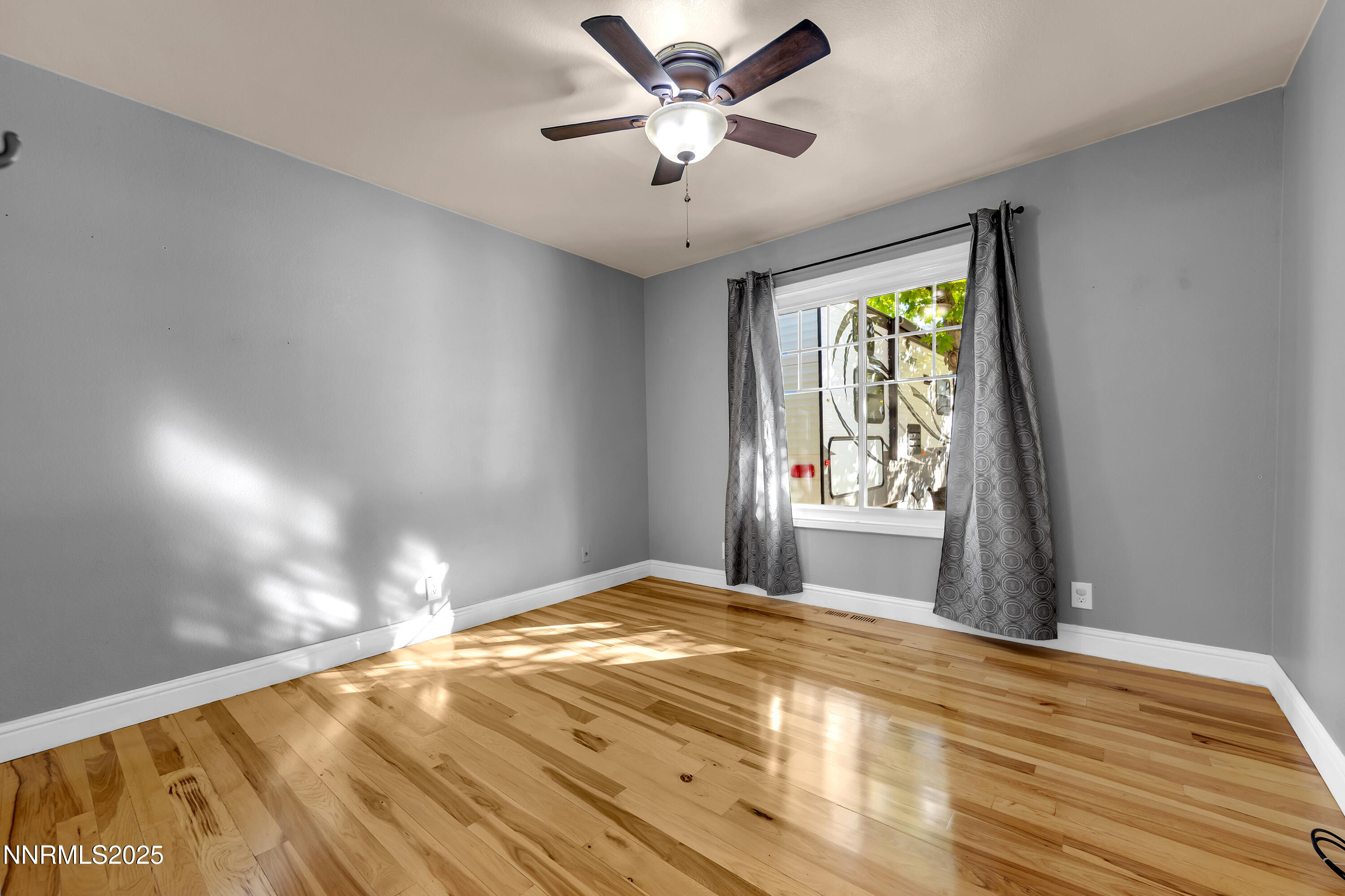 2835 Parkway Drive Reno, NV 89502 - Photo 26 of 39 a view of a livingroom with a window and a ceiling fan