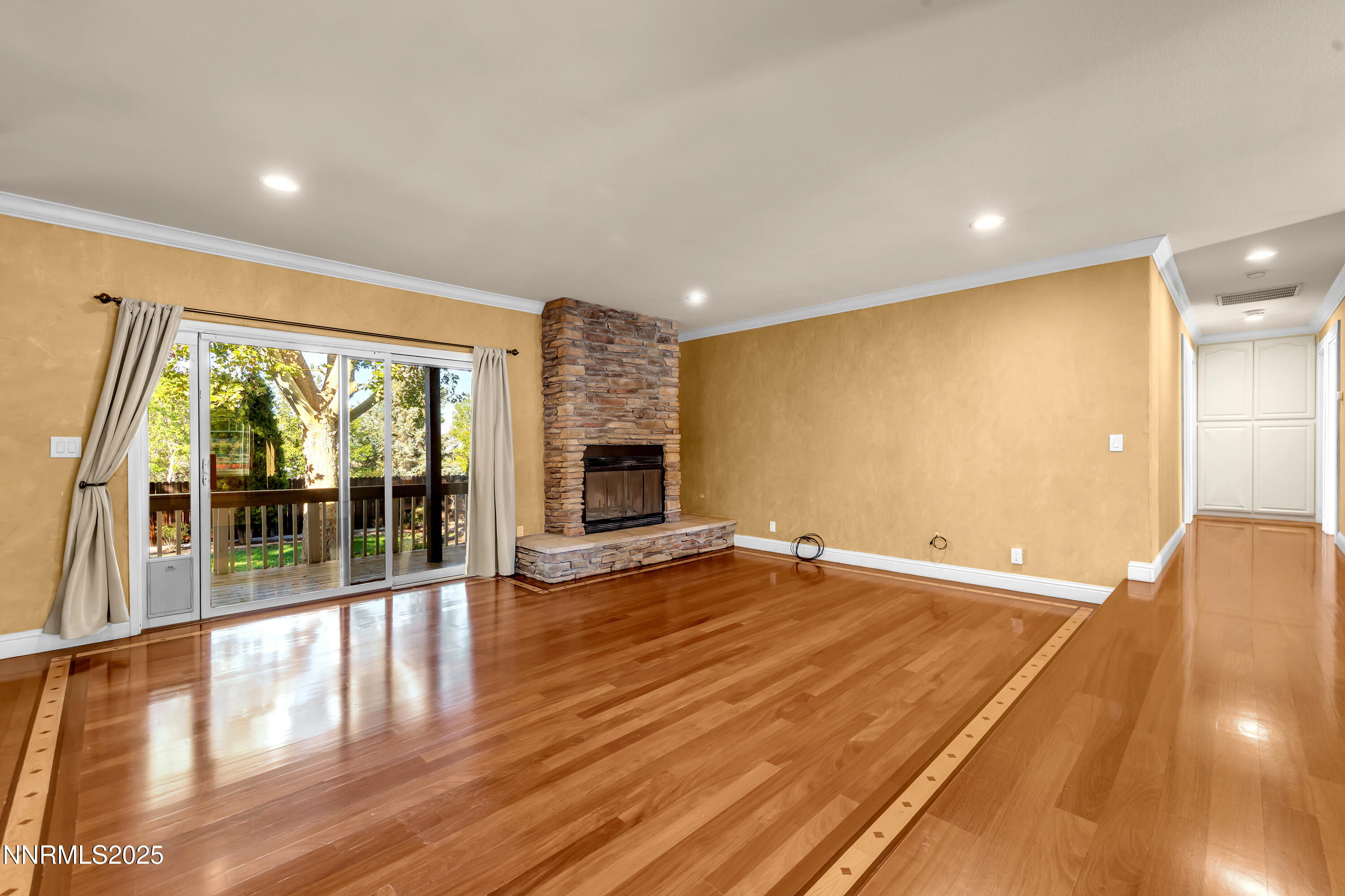 2835 Parkway Drive Reno, NV 89502 - Photo 4 of 39 an empty room with wooden floor and glass door