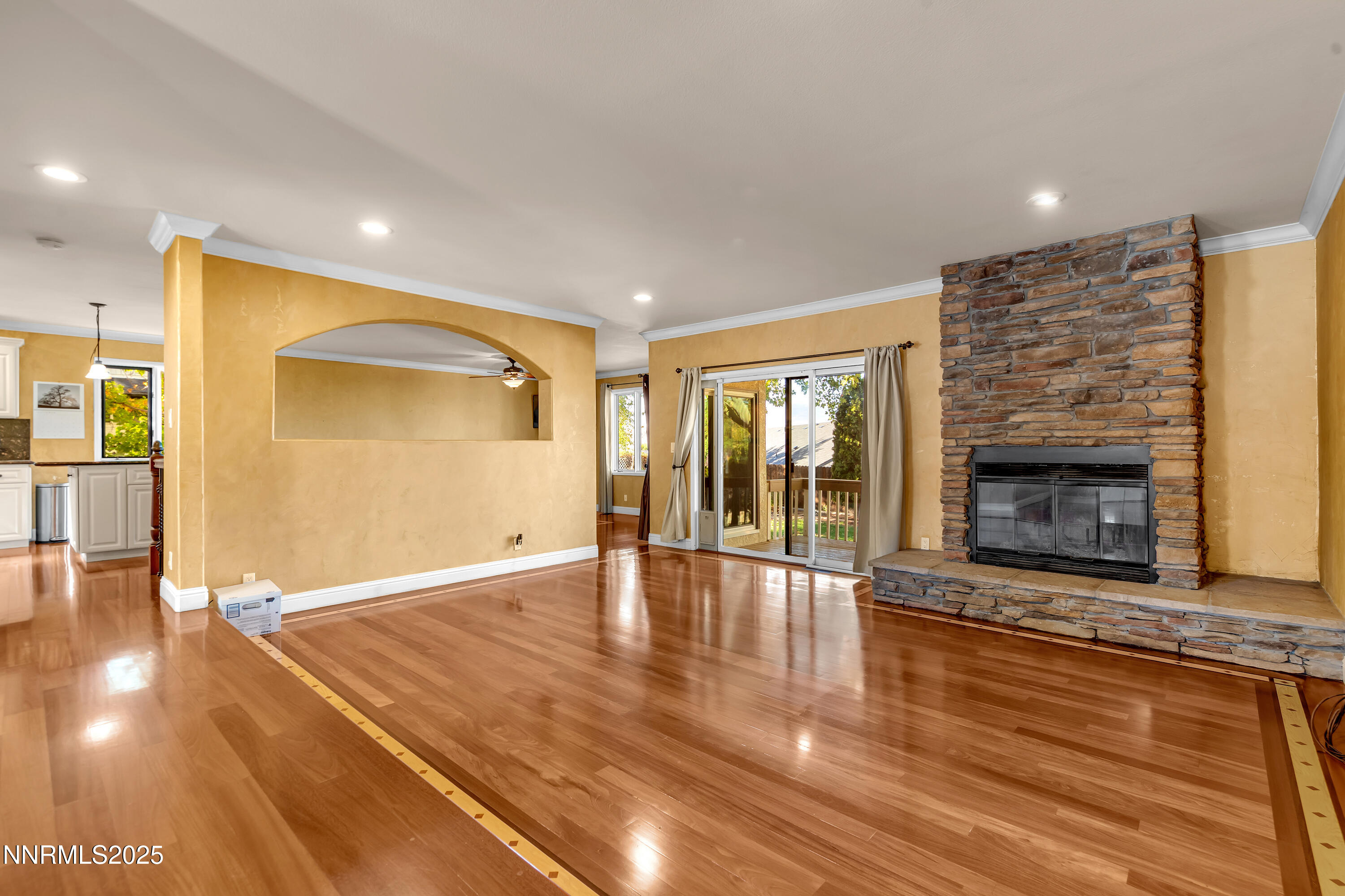2835 Parkway Drive Reno, NV 89502 - Photo 5 of 39 a view of an empty room with wooden floor and a fireplace