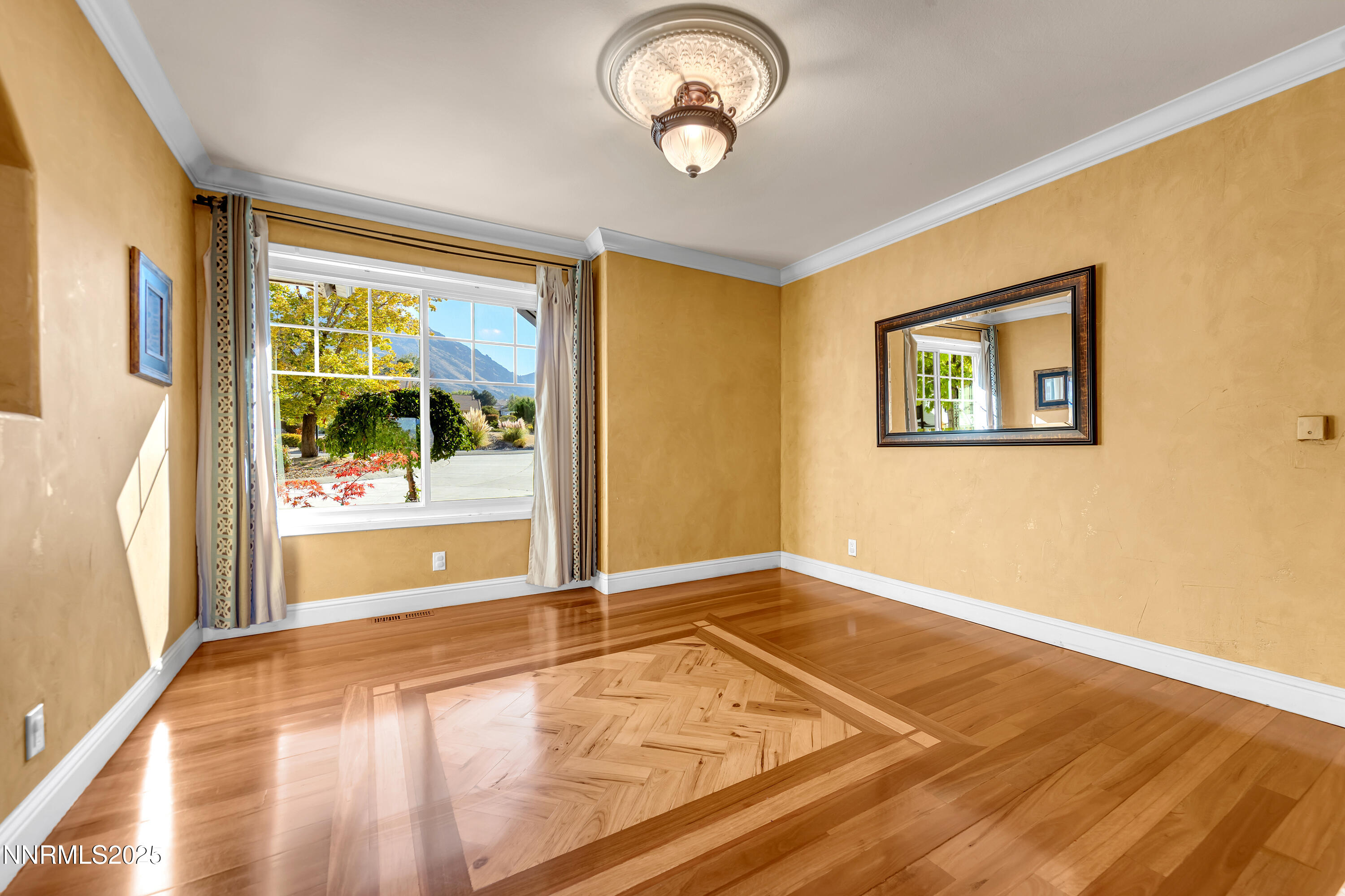 2835 Parkway Drive Reno, NV 89502 - Photo 6 of 39 a view of empty room with wooden floor and fan